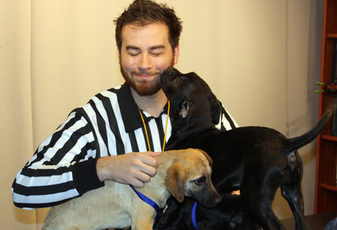 Animal PLanet producer and Puppy bowl referee Andrew Schecter with three Kent pups.