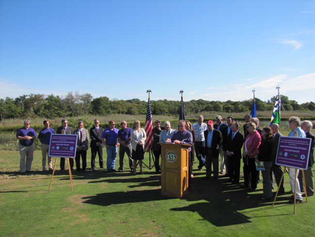 Elected officials, environmental groups and others gathered at a press conference on Riverhead's sewer treatment plant upgrade Friday at Indian Island golf course. Tim Gannon photo.
