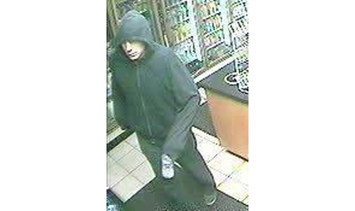 SURVEILLANCE PHOTO | Suffolk police said Paul Tromblee of Manorville has been identified as the man in this surveillance photo. He is charged with nine counts of armed robbery.