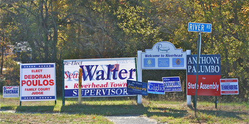 BARBARAELLEN KOCH PHOTO | A group of political signs on the corner of River Road and Route 25.