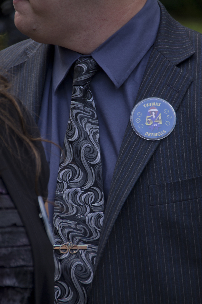 Buttons honoring Tom Cutinella at his funeral Tuesday. (Credit: Paul Squire)
