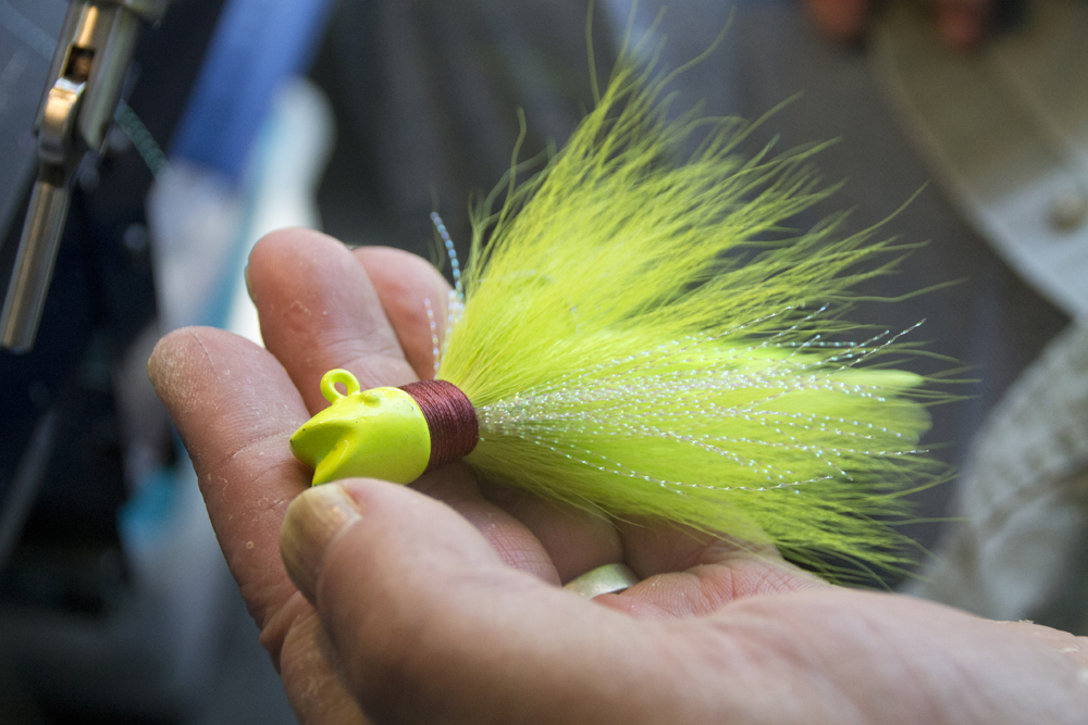 Mr. Purificato holds a new bucktail lure in his hand. The bucktails only take about a minute to make each. (Credit: Paul Squire)