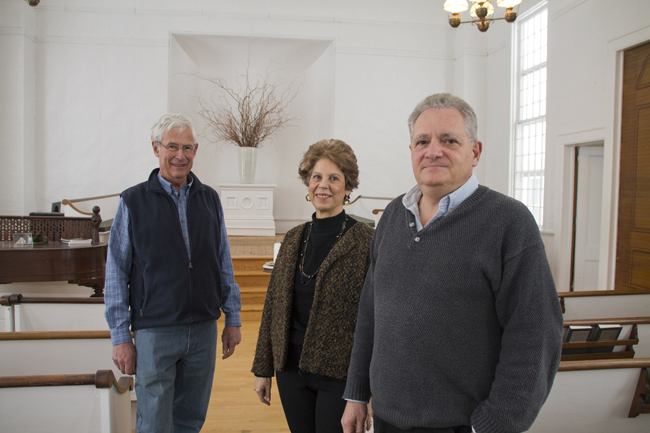 Local historian Richard Wines (left) along with Doris McGreevey and Richard Radoccia stand in the Jamesport Meeting House, where Mr. Radoccia and Ms. McGreevey hope to present a play about the Civil War on the 150th anniversary of its end. (Credit: Paul Squire)
