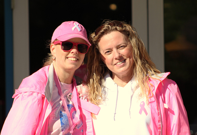 From left, Tracey of St. James, a breast cancer survivor, with her sister, Deanna, of Manorville.