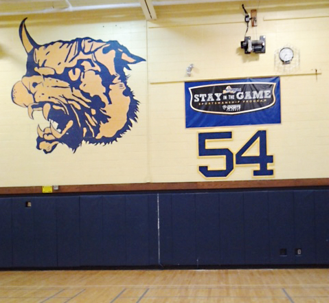 The No. 54 plaque was recently placed on the wall of Shoreham-Wading River High School's gym. (Credit: John Glenn School District)