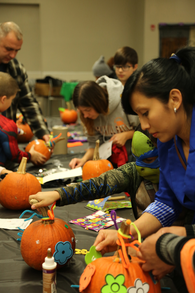 Riverhead High School Key Club's Safe Halloween event included arts and crafts like pumpkin decorating in the school's cafeteria.