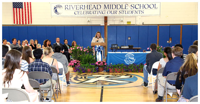 Riverhead Middle School Principal Andrea Pekar gives a short congratulatory speech to the middle school students who received awards at the Middle School's Academic Awards Night. (Credit: Sandra Kolbo, Riverhead schools)