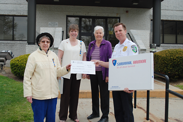 Georgette Case, Anne Otten and Marilyn Runyan of the Daughters of the American Revolution presented Riverhead police chief David Hegermiller a $350 check. (Credit: Riverhead police)