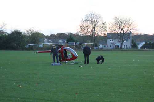 A helicopter crash-landed in an Aquebogue field Sunday afternoon. (Credit: Jen Nuzzo)