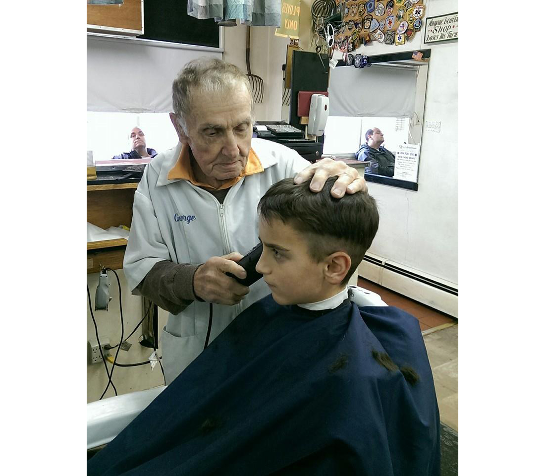 George Kurovics at work in his Rocky Point barbershop. (Credit: Courtesy photo)