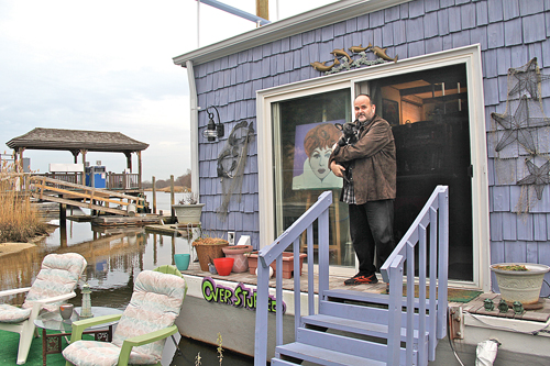 Houseboat owner Michael Evers with his puppy Tallulah. (Credit: Carrie Miller)