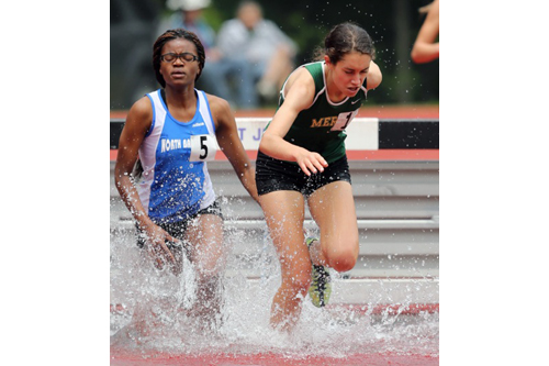 Bishop McGann-Mercy's Delina Auciello makes a splash as the top Division II finisher in the 2,000-meter steeplechase. She was 12th overall in 7 minutes 41.59 seconds. (Credit: Daniel De Mato)