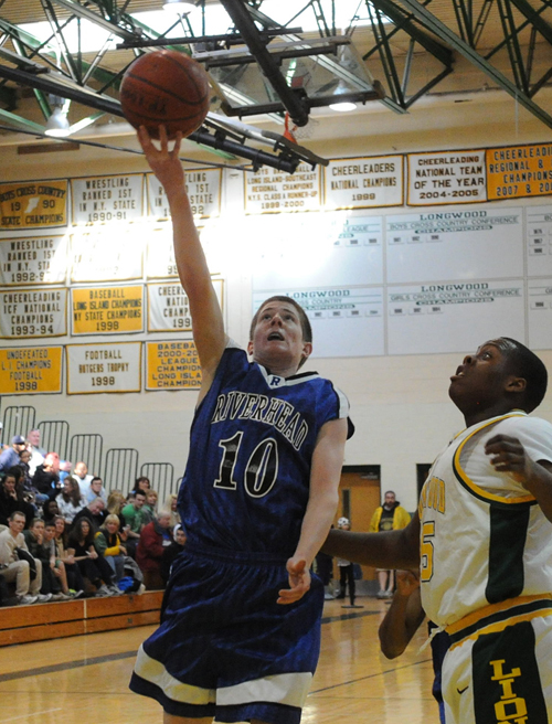 ROBERT O'ROURK PHOTO  |  Riverhead sophomore Ryan Bitzer scored eight points for the Blue Waves Saturday.