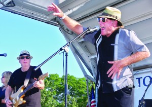 BARBARAELLEN KOCH PHOTO | Gary Utah on vocals and percussion performing with the Bobby Nathan band and Joanne and Bobby Nathan (far left) at 2012's Riverhead Blues and Music Festival.