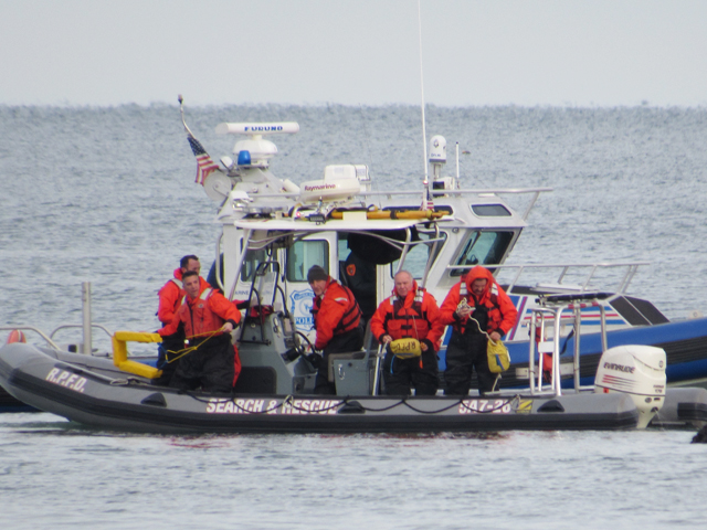 A search and rescue boat from the Rocky Point Fire Department and a Suffolk County marine boat in Long Island Sound Sunday. (Credit: courtesy of Emily Espenkotter)