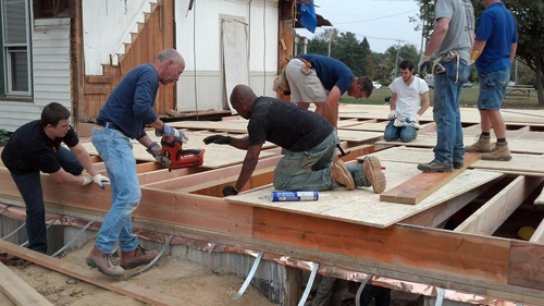 NEW BEGINNINGS COURTESY PHOTO | Volunteers helping frame the first floor of New Beginning Brendan House on Sound Avenue.