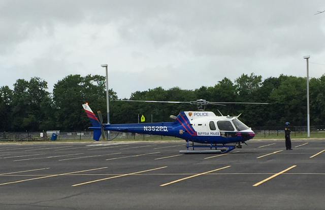 A police helicopter landed at Riverhead High School to transport the victim. (Credit: Lauren Lustgarten)