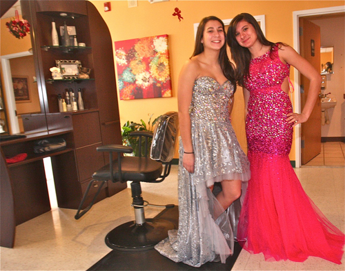 BARBARAELLEN KOCH PHOTO  |  Riverhead High School students Mychala Conti, 15, and sister Rachel, 17, tried on some of the 2013 'Jovani' prom dresses after having their hair styled. They said that their mom thought it would be a fun outing for them.