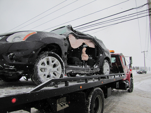 A Nissan SUV spun off Sound Avenue Tuesday morning. (Credit: Tim Gannon)