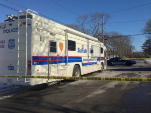 PAUL SQUIRE PHOTO | A mobile command post in front of Demitir Hampton's home on Priscilla Ave. in Flanders, where police say the 21-year-old was shot and killed by armed burglars early Sunday morning.