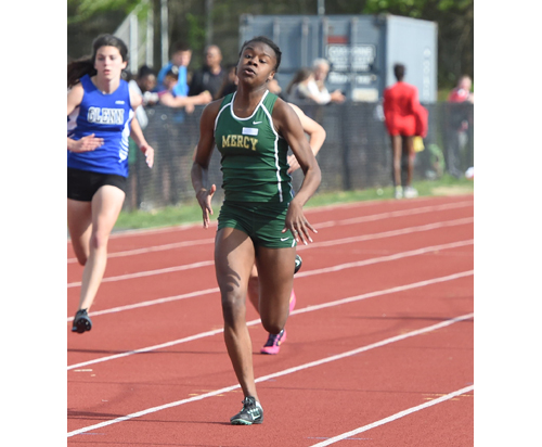 McGann-Mercy senior Danisha Carter, shown here Monday in the preliminaries, ran a personal best time in the 200-dash Wednesday at the Division III Championships. (Credit: Robert O'Rourk)