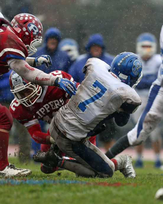 Riverhead's Ryun Moore takes a hard hit that knocked him out of the game. (Credit: Daniel De Mato)