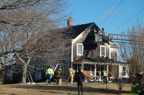 Firefighters inspect the damage to the home. (Credit: Cyndi Murray)