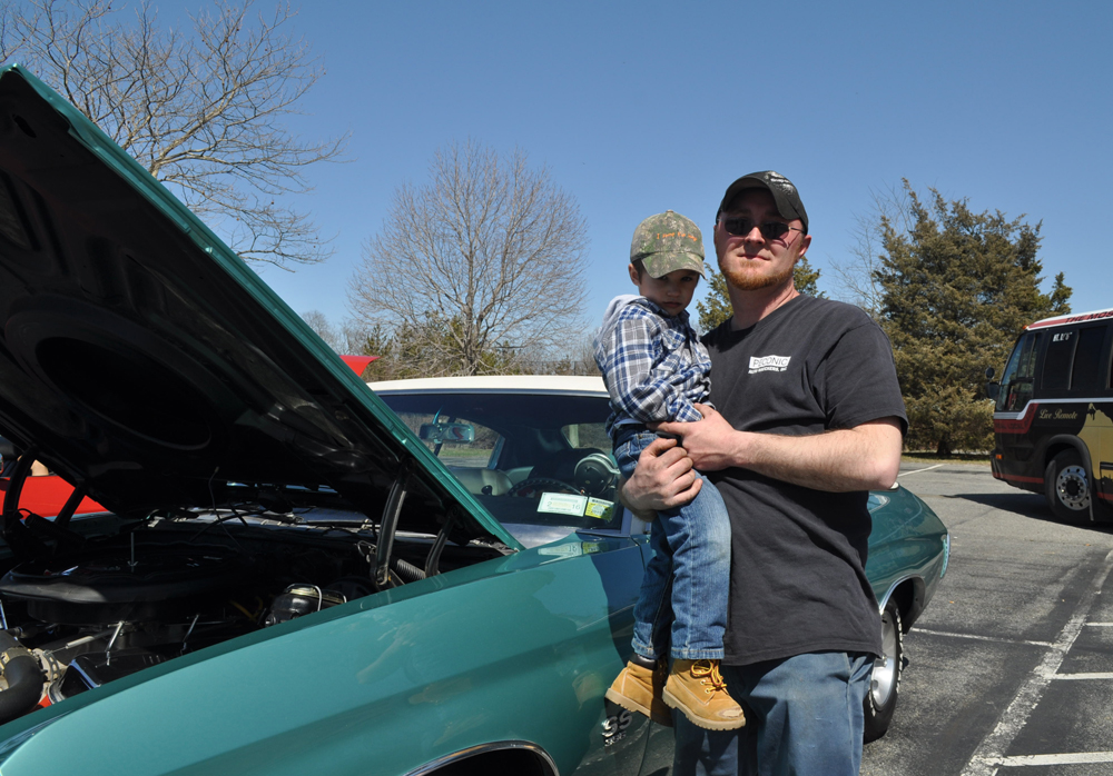Tobie Wesnofske of Cutchogue with Nathan Ovsianik in front of a 1970 Chevy first owned by his father. (Credit: Vera Chinese)