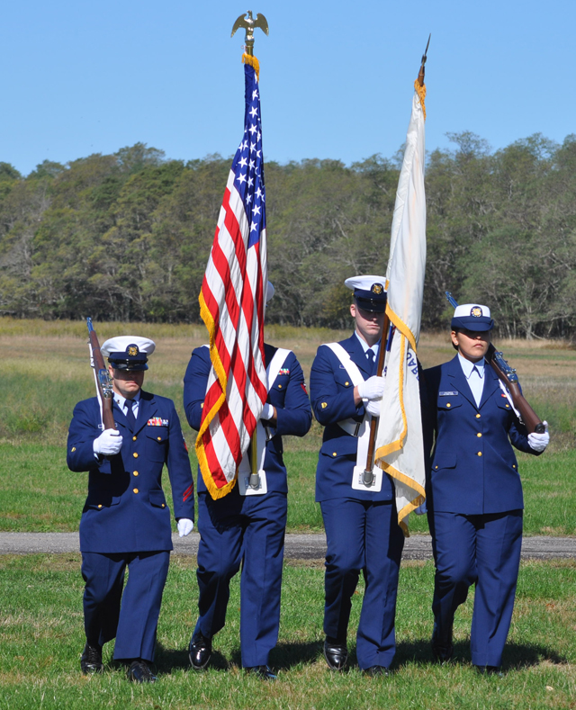 Members of the United States Coast Guard present the colors Sunday. (Credit: Grant Parpan)