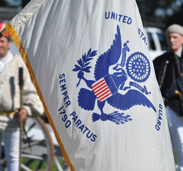 Members of the United States Coast Guard present the colors Sunday. (Credit: Grant Parpan)
