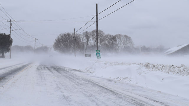 Drifts have caused poor visibility along stretches of Main Road and Sound Avenue Sunday as well as other open-space areas. (Credit: Vera Chinese)