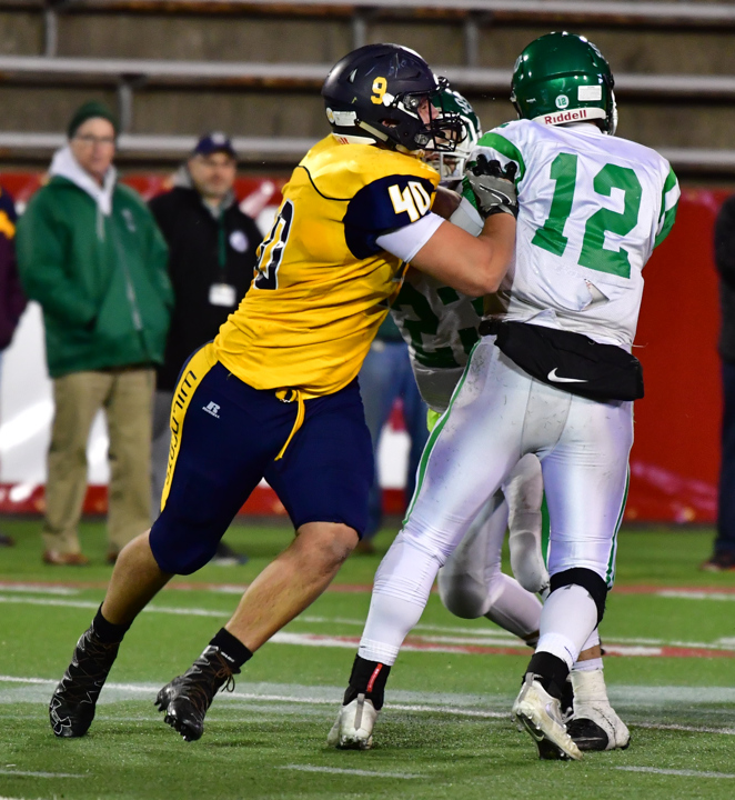 Ethan Wiederkehr chases after the Seaford quarterback. (Credit: Robert O'Rourk)