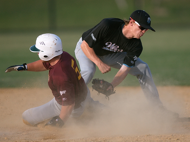 Dan Popio of Riverhead, who tied for second in the HCBL with five home runs, sliding into second base while Sag Harbor second baseman Ted Shaw covers the bag. (Credit: Garret Meade)