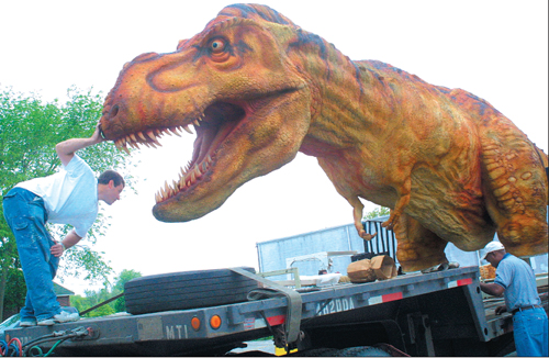 Barbaraellen Koch file photo | Employees of the Dinosaur Walk set up shop in Riverhead in 2004.