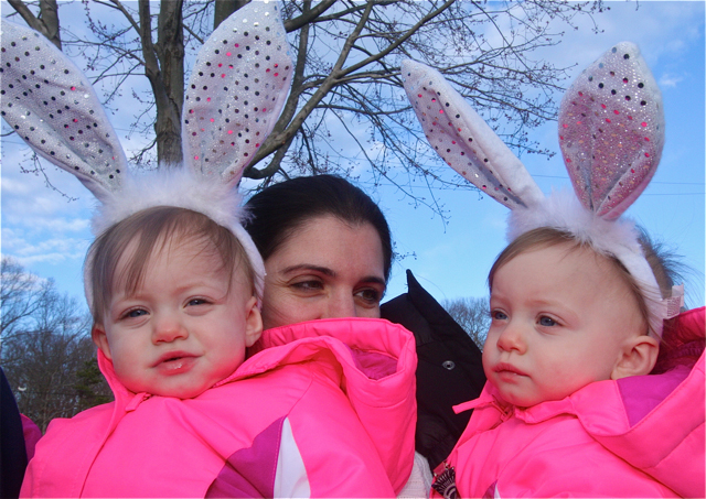 Donna Amoscato of Shirley, formerly of Riverhead, with her twins Mia (left) and Alanna, 1, wait for the first egg hunt to start. (Credit: Barbaraellen Koch)