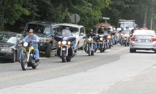TIM GANNON PHOTO | Bikers arrive at The Maples in Manorville, the second stop of a charity poker run to defray medical costs of Tom Jasinski, a longtime Riverhead Firefighter who recently died.