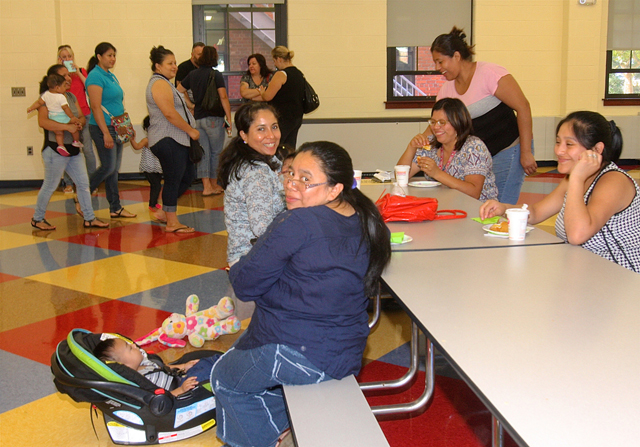 After dropping off their children, parents gathered in the new cafeteria for what the school calls the "Boo-Hoo" breakfast.