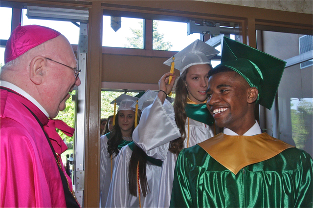 Bereket Watts of Southold flashes a warm smile for Bishop William Murphy. (Credit: Barbaraellen Koch)