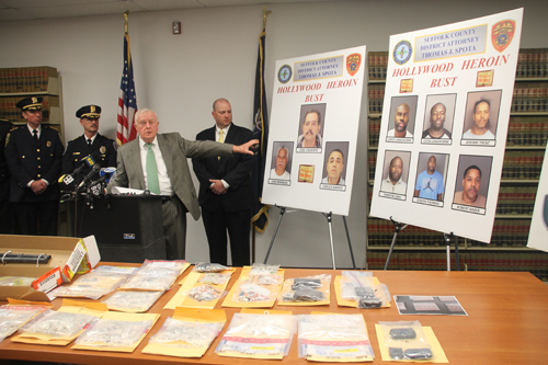 PAUL SQUIRE PHOTO | District attorney Thomas Spota points to the suspects arrested in a heroin trafficking ring at a press conference Wednesday.