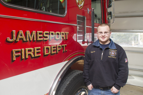 Dan Doroski stands in front of his company's Engine No. 3 at the Jamesport firehouse (Credit: Paul Squire)