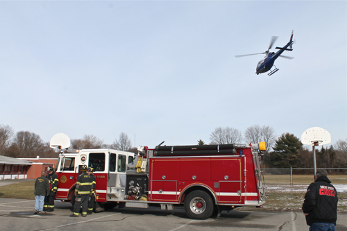 PAUL SQUIRE PHOTO | A Suffolk County police helicopter airlifts a crash victim from Miller Avenue Elementary School