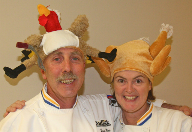 Chef instructors Vinny Winn and Andrea Glick get in the holiday spirit with their head gear. (Credit: Barbaraellen Koch)