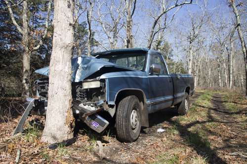 On Monday morning, the crashed truck of Ronald Diachun still remained crunched into the tree he hit while fleeing to get help Saturday night. (Credit: Paul Squire)