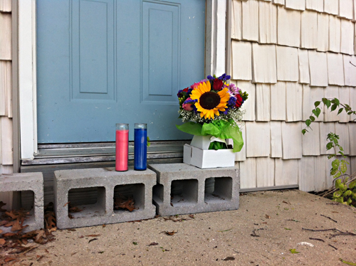 Flowers and candles were laid in the doorway of Ms. Bradstreet's home. (Credit: Carrie Miller photo)