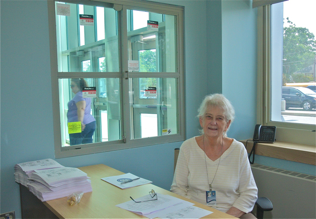 Mary Kruel mpw is in the main office with a window to check in visitors. Before she was in the hallway by the front doors.