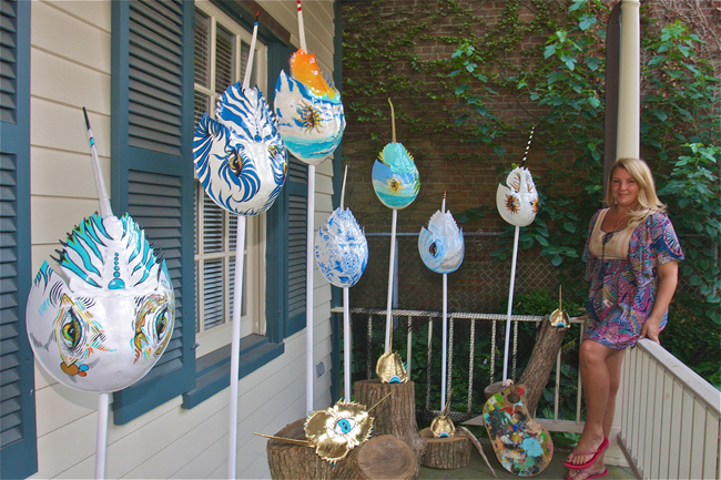 Kristina Howard of Center Moriches with her painting on horseshoe shell on the front porch of the East End Arts. (Credit: Barbaraellen Koch)