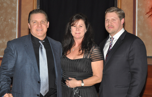 PAUL SQUIRE PHOTO | Timothy Stevens and Edward Harmes of Island International Industries with award presenter Tracy James.