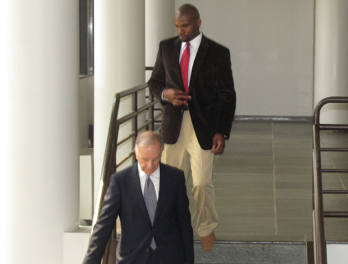  Joe Johnson (top) leaves court in 2012 with a lawyer. (Credit: Tim Gannon, file)