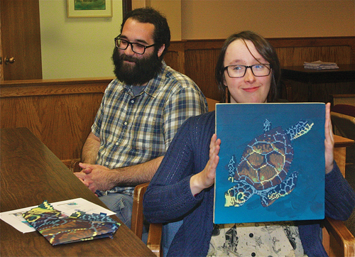 During the Town Board's work session last Thursday morning, illustrator Samantha Neukirch and her assistant, Joe Arias, presented her plans to install a mixed media mural project near the River and Roots community garden. (Credit: Barbaraellen Koch)