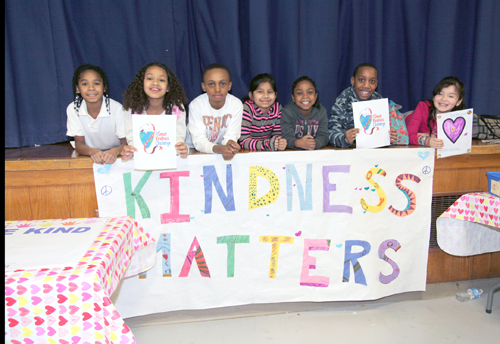SANDY KOLBO COURTESY PHOTO | Phillips Avenue Elementary School students pose with their "Kindness Matters" banner.
